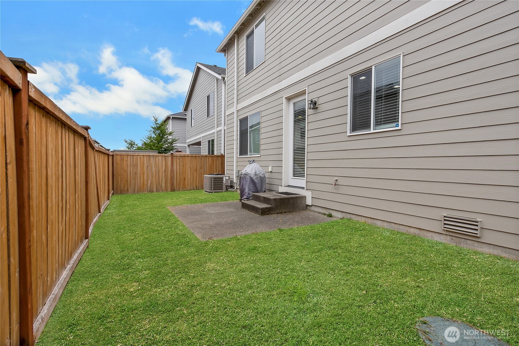 5014 Kenrick Street Southeast Lacey, WA 98503 - Photo 21 of 22 a view of a backyard with table and chairs and a barbeque