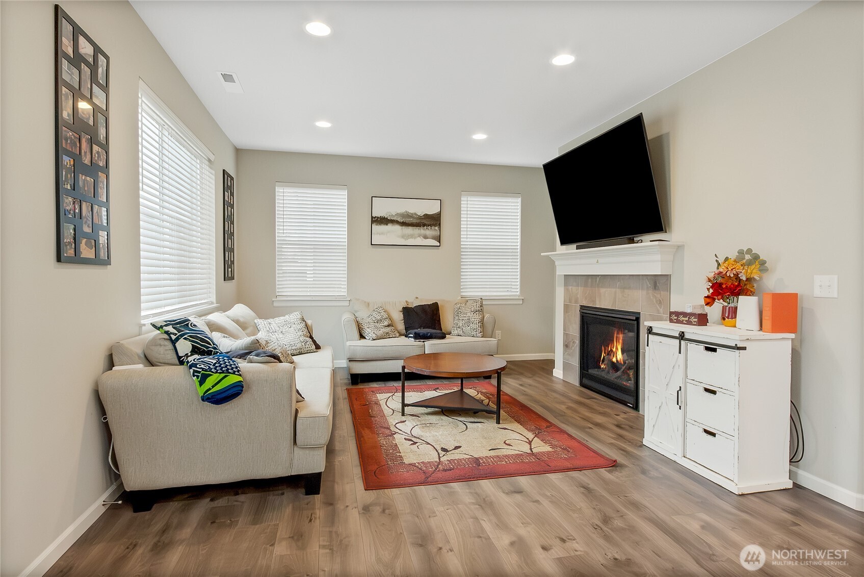 5014 Kenrick Street Southeast Lacey, WA 98503 - Photo 8 of 22 a living room with furniture fireplace and flat screen tv