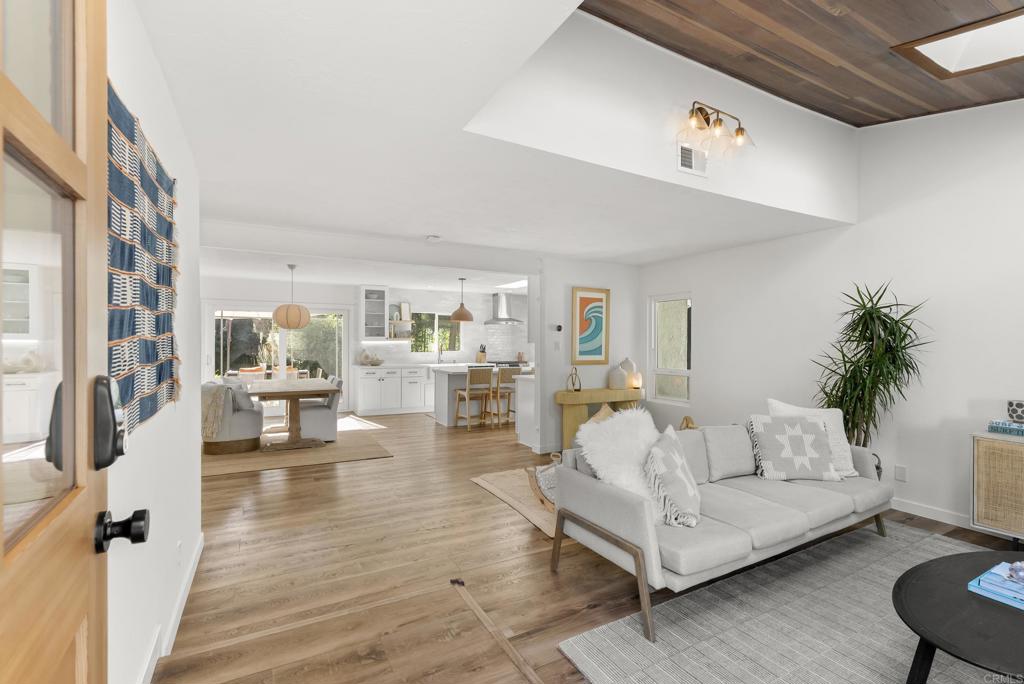 1427 Avocado Road Oceanside, CA 92054 - Photo 11 of 57 a living room with furniture and wooden floor