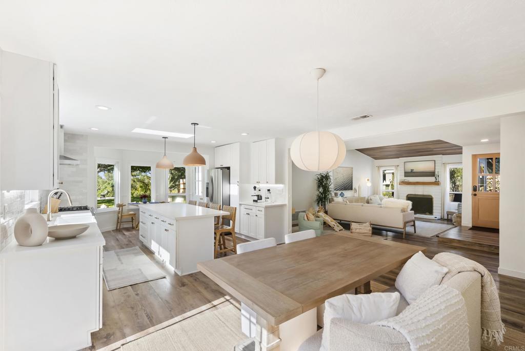 1427 Avocado Road Oceanside, CA 92054 - Photo 13 of 57 a living room with furniture and a chandelier