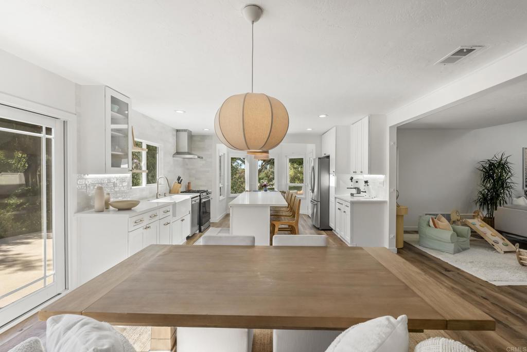 1427 Avocado Road Oceanside, CA 92054 - Photo 15 of 57 a living room with furniture a window and kitchen view