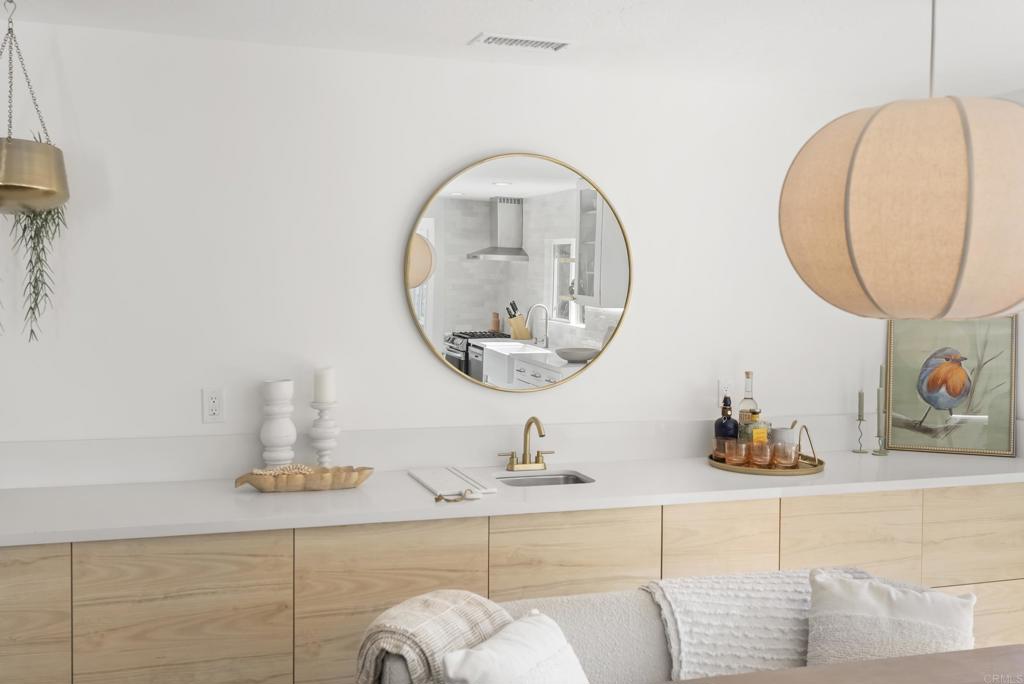 1427 Avocado Road Oceanside, CA 92054 - Photo 19 of 57 a bathroom with a sink and a mirror