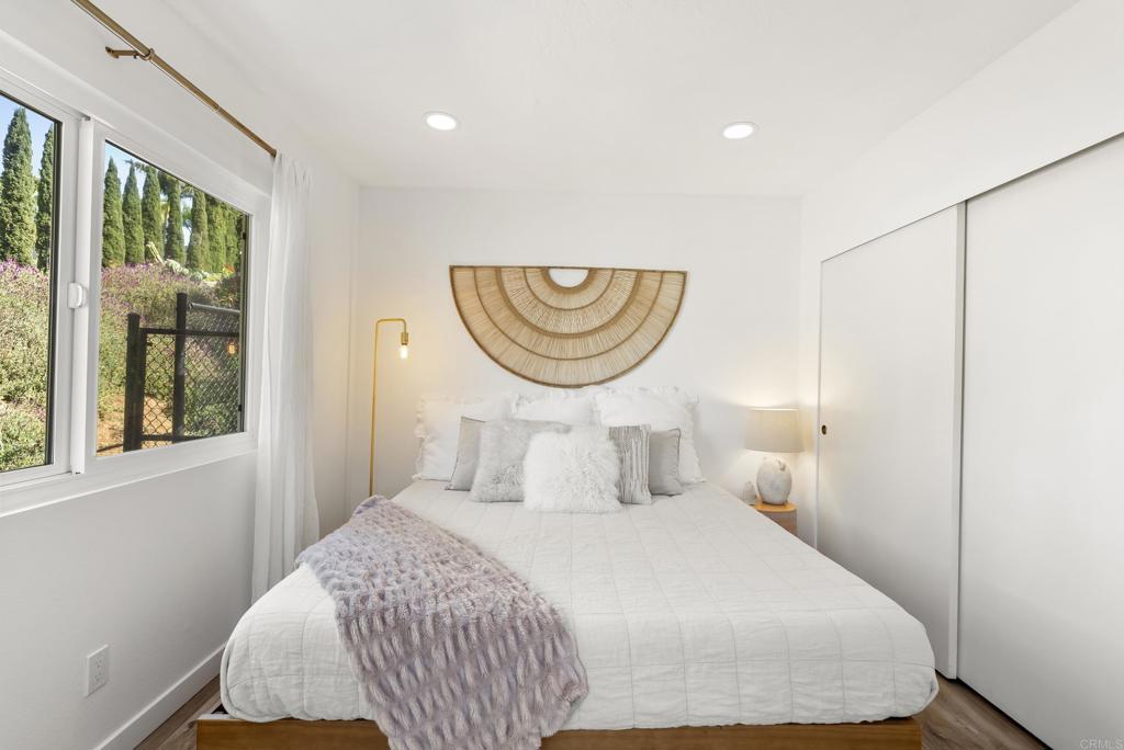 1427 Avocado Road Oceanside, CA 92054 - Photo 27 of 57 a bedroom with a bed and a window