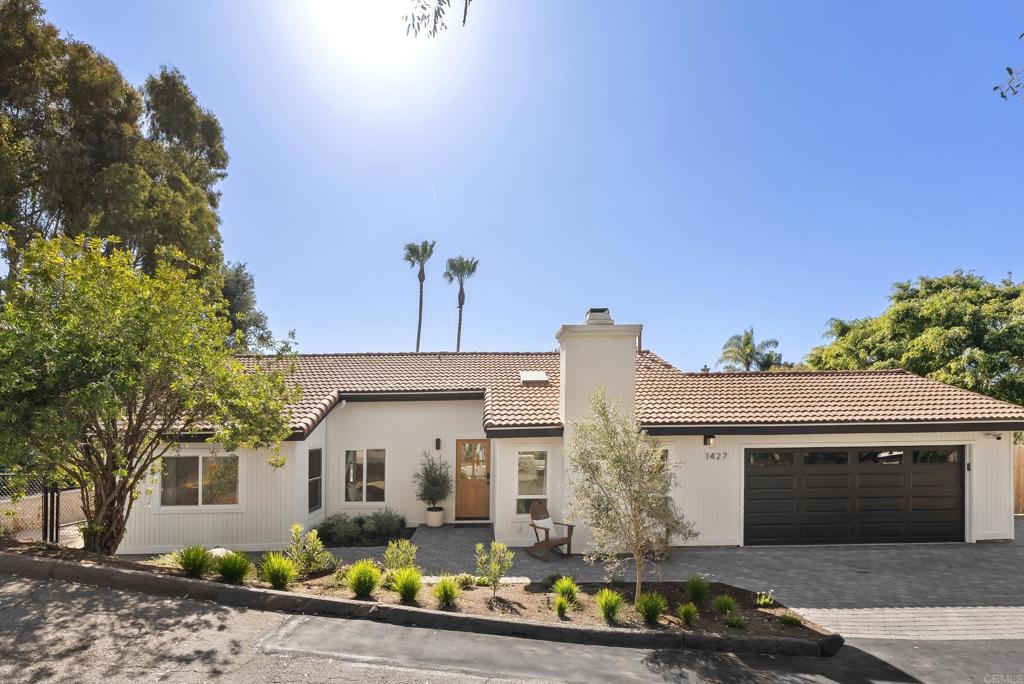 1427 Avocado Road Oceanside, CA 92054 - Photo 3 of 57 a front view of a house with garden