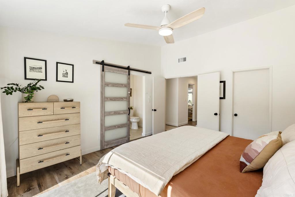 1427 Avocado Road Oceanside, CA 92054 - Photo 31 of 57 a bedroom with a bed and a dresser