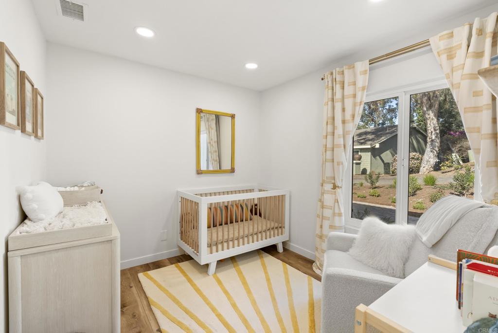 1427 Avocado Road Oceanside, CA 92054 - Photo 34 of 57 a bedroom with a bed and a window