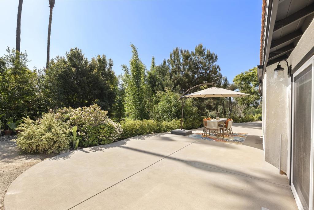 1427 Avocado Road Oceanside, CA 92054 - Photo 39 of 57 a view of a backyard with chairs and a small yard