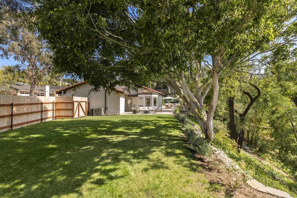 1427 Avocado Road Oceanside, CA 92054 - Photo 42 of 57 a front view of a house with a yard