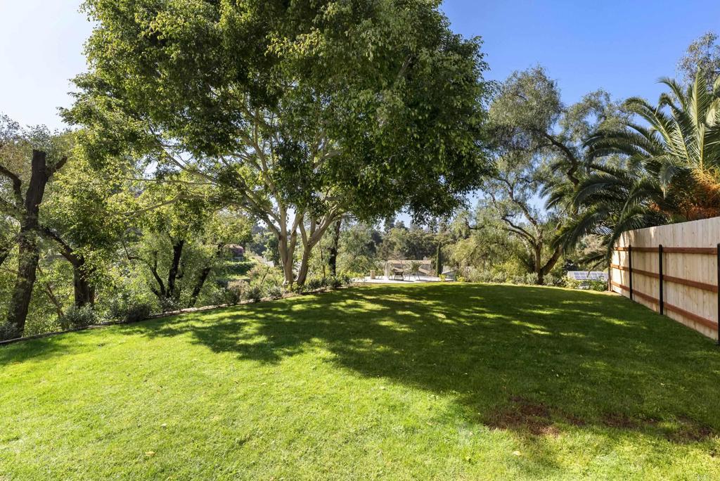 1427 Avocado Road Oceanside, CA 92054 - Photo 43 of 57 a backyard of a house with trees