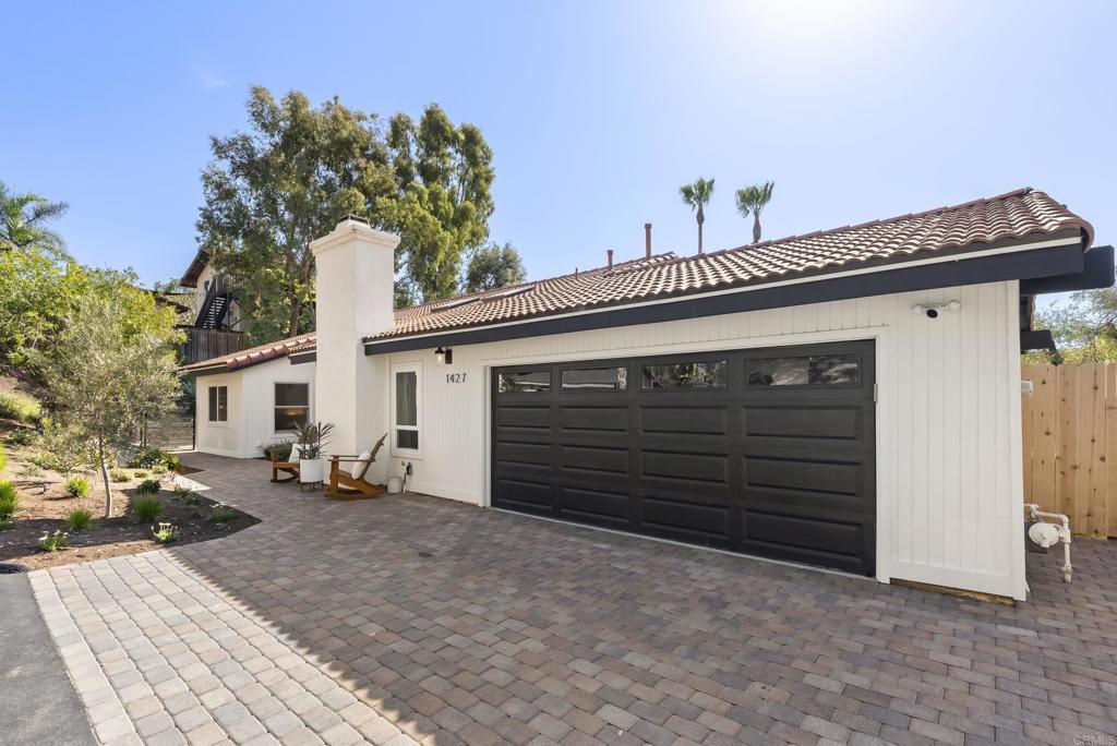 1427 Avocado Road Oceanside, CA 92054 - Photo 5 of 57 a view of a house with a yard and garage