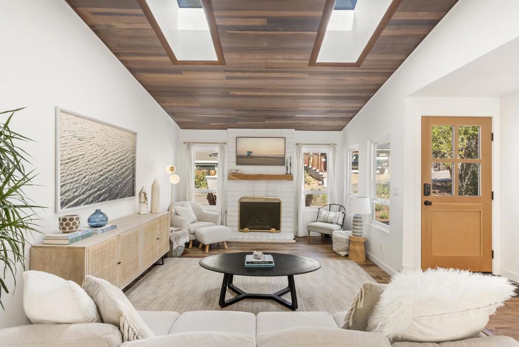 1427 Avocado Road Oceanside, CA 92054 - Photo 8 of 57 a living room with furniture and a fireplace