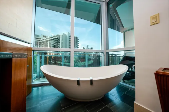 a view of a tub sitting in a bathroom