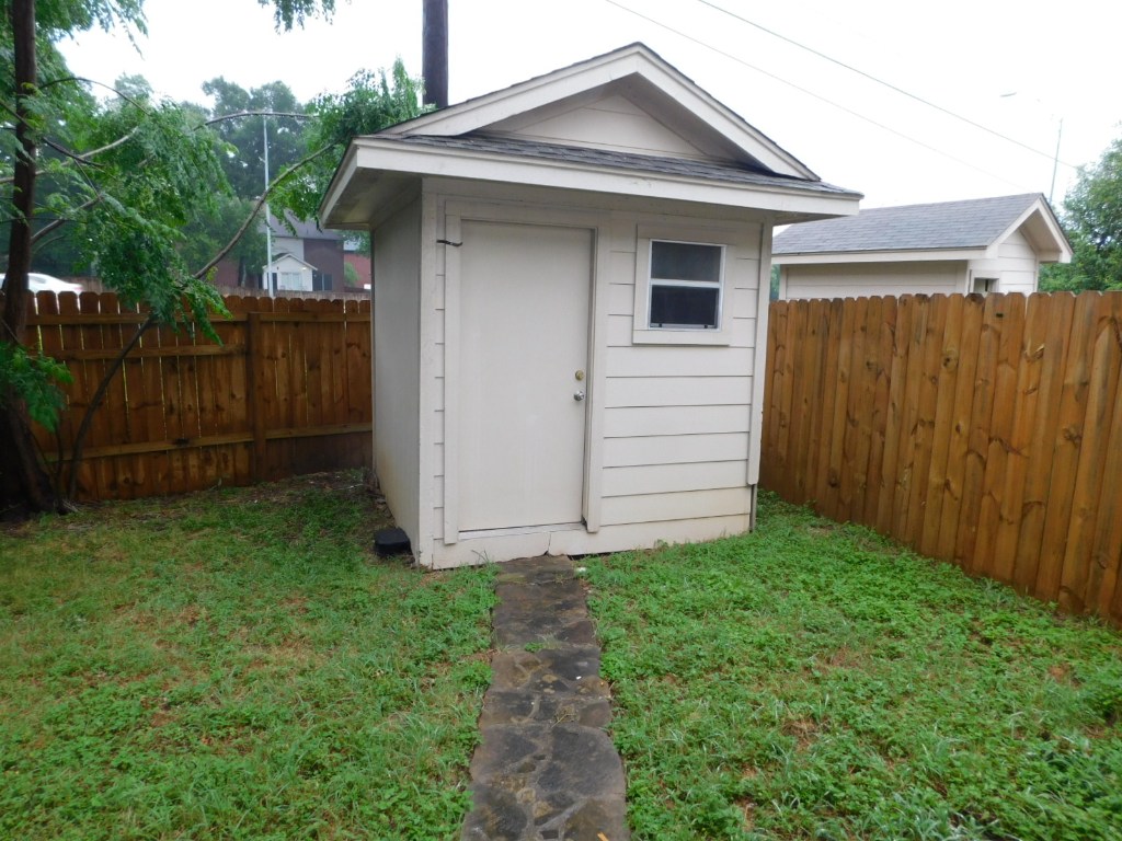 8208 Hood Circle, Unit A Austin, TX 78745 - Photo 11 of 14 a view of a house with a yard