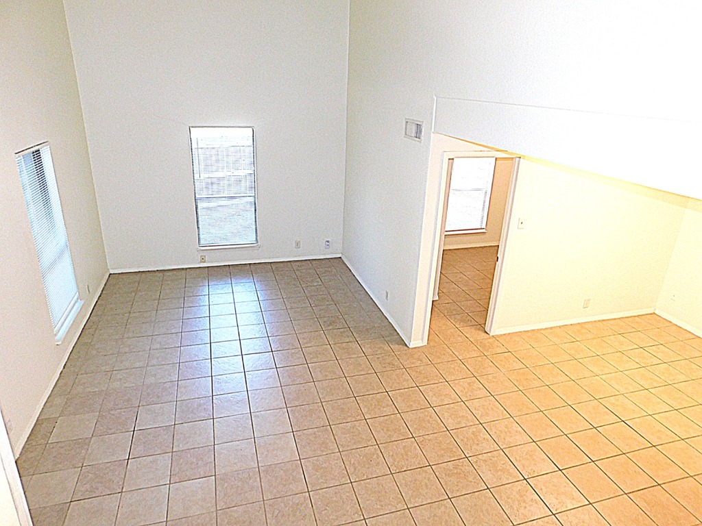 8208 Hood Circle, Unit A Austin, TX 78745 - Photo 4 of 14 an empty room with windows