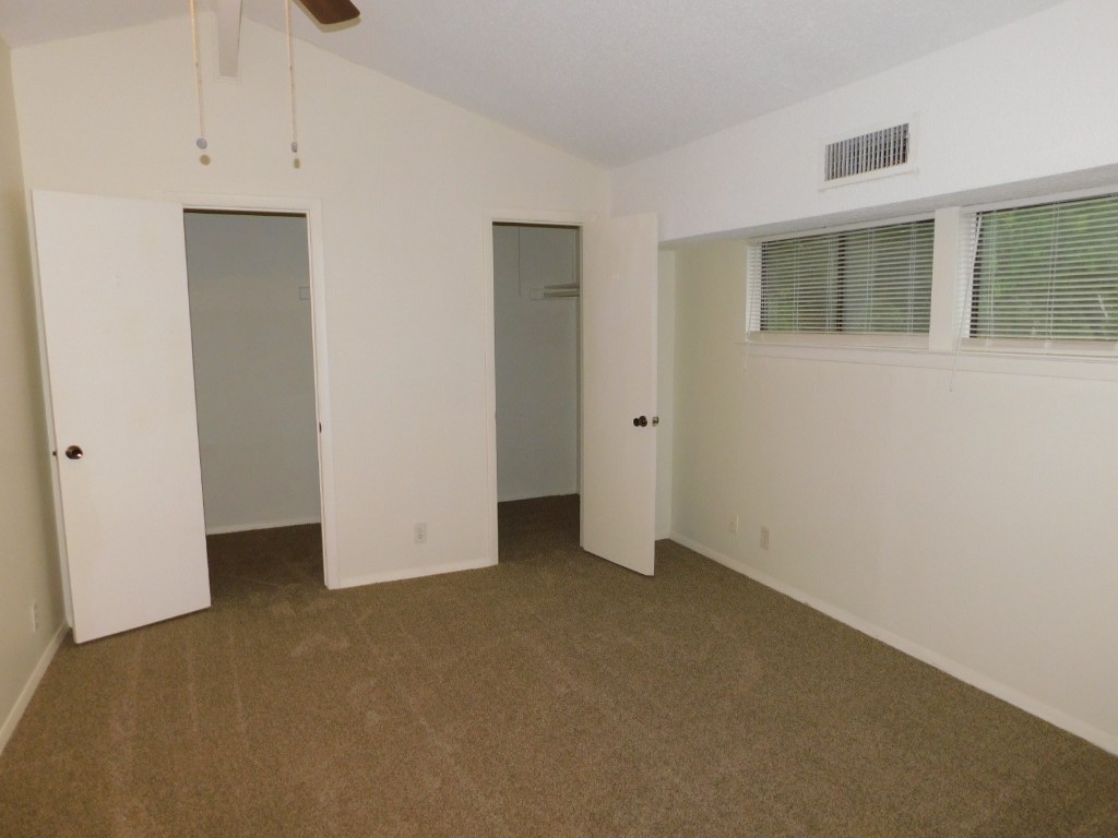8208 Hood Circle, Unit A Austin, TX 78745 - Photo 9 of 14 an empty room with windows