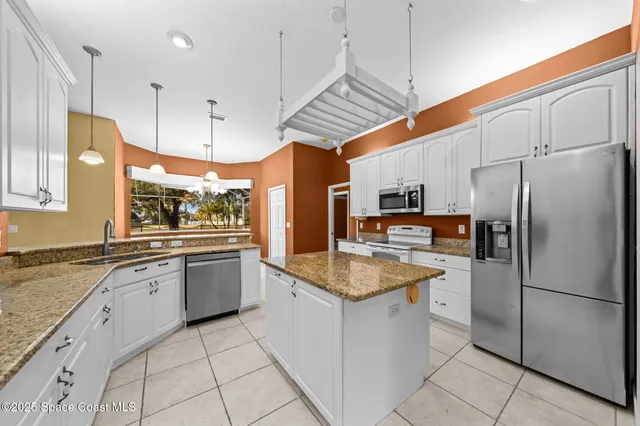 a view of room with window and ceiling fan
