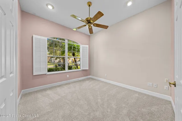 en empty room with window and outdoor view