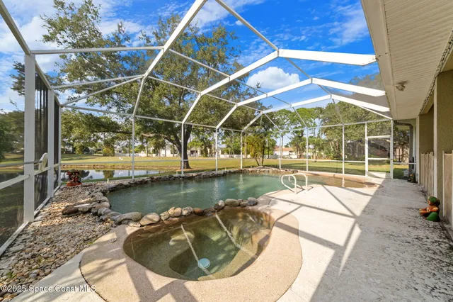a view of a swimming pool with a patio