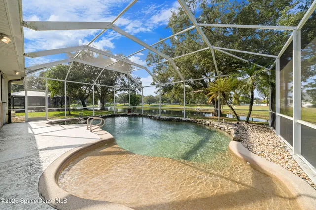 a view of a swimming pool with a patio
