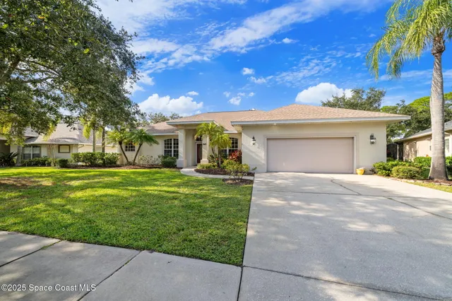 a view of a swimming pool with a yard