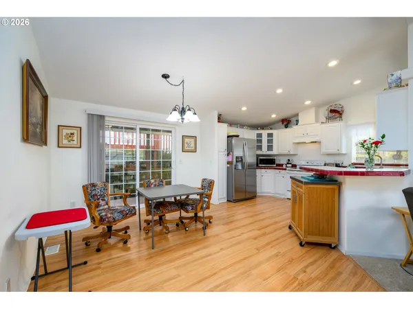 a living room with stainless steel appliances kitchen island granite countertop furniture and a view of kitchen