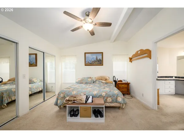 a bed room with furniture and a chandelier