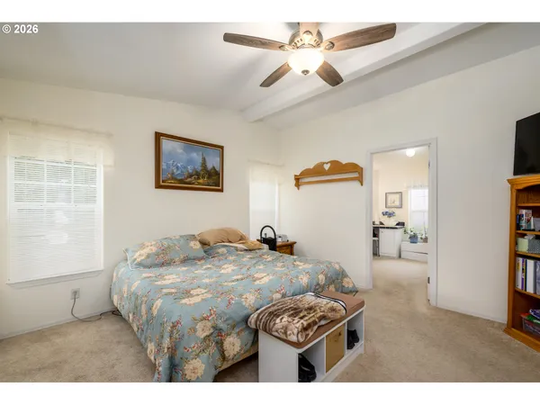 a bedroom with furniture and a chandelier