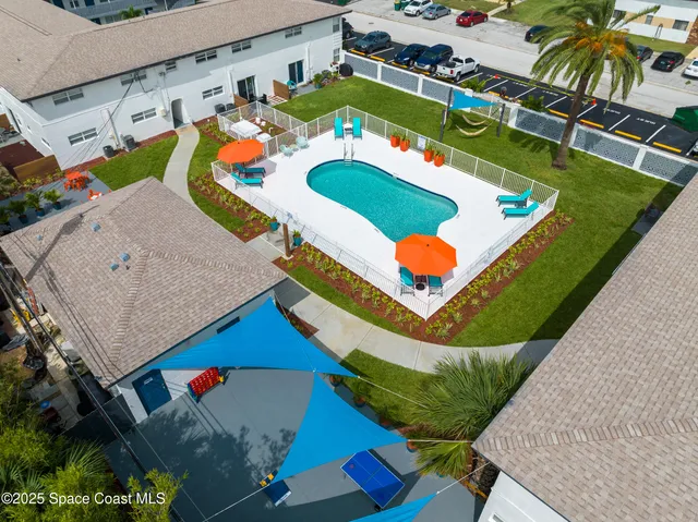 a view of a patio with table and chairs and potted plants