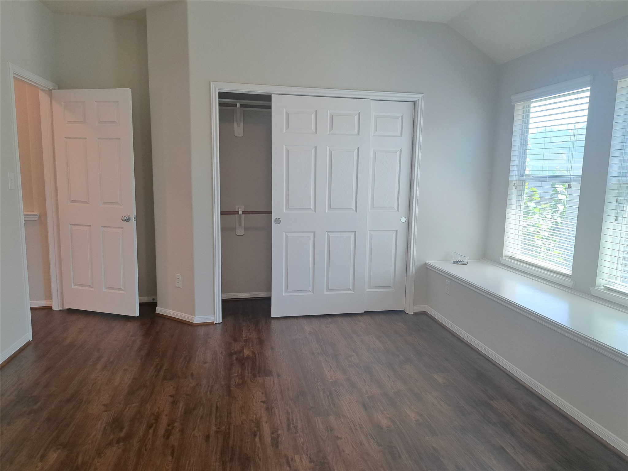 26315 Fox Ridge Lane Katy, TX 77494 - Photo 30 of 39 a view of an empty room with wooden floor and a window