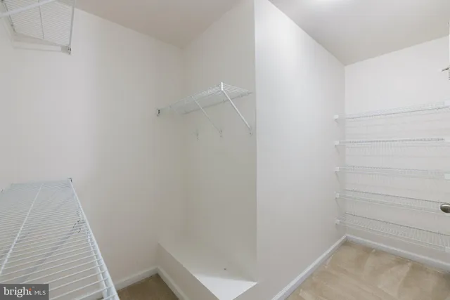 a bathroom with a granite countertop sink mirror and double