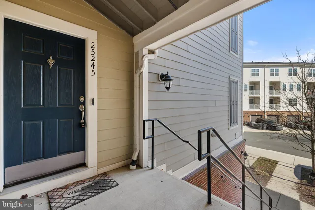 a balcony with table and chairs