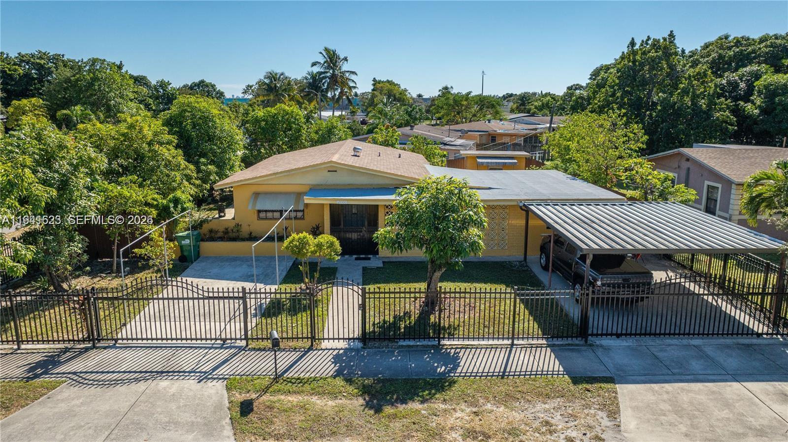 2000 Northwest 131st Street Miami, FL 33167 - Photo 1 of 18 aerial view of a house with a yard