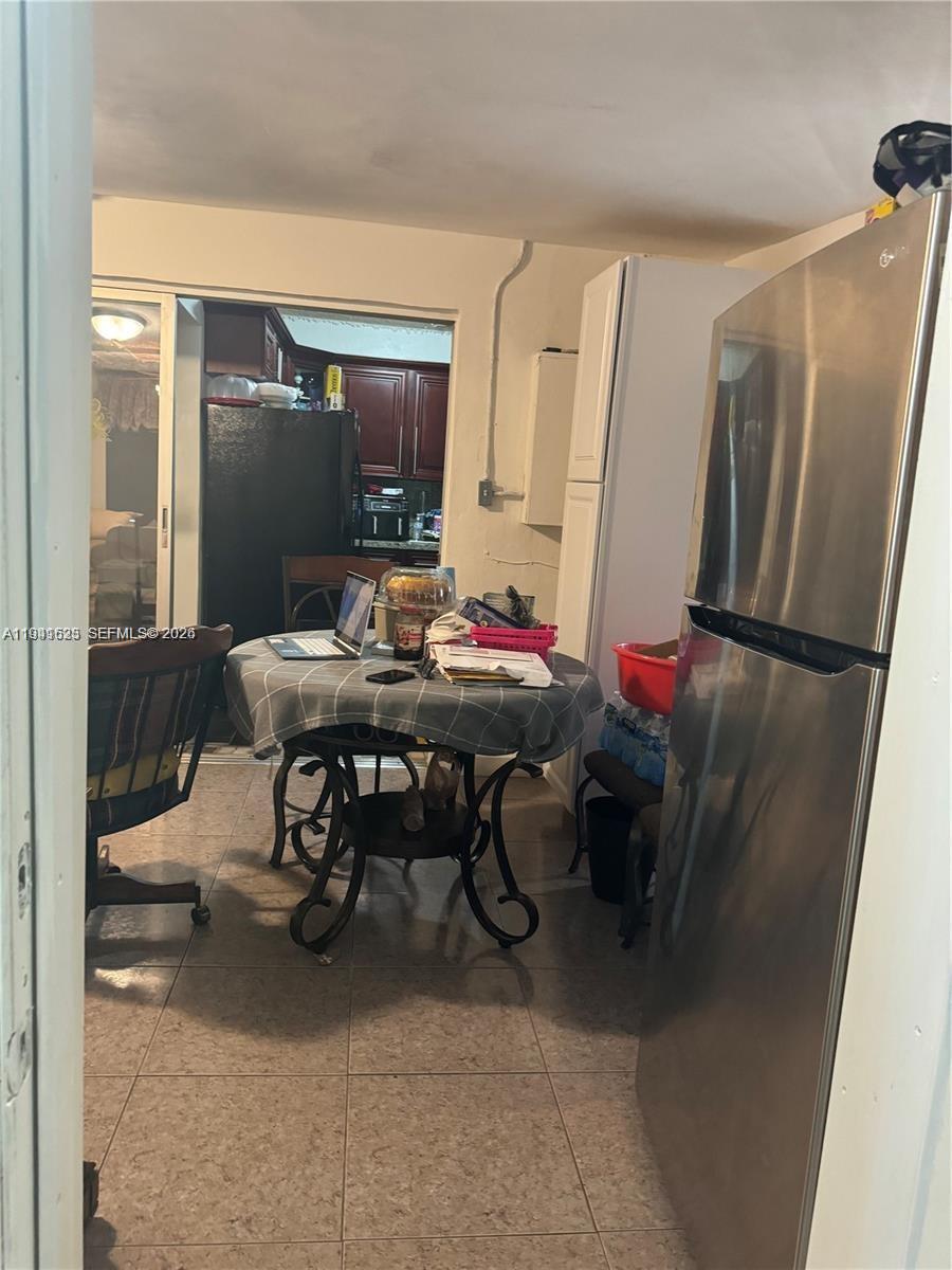 2000 Northwest 131st Street Miami, FL 33167 - Photo 8 of 18 a view of a dining room with furniture