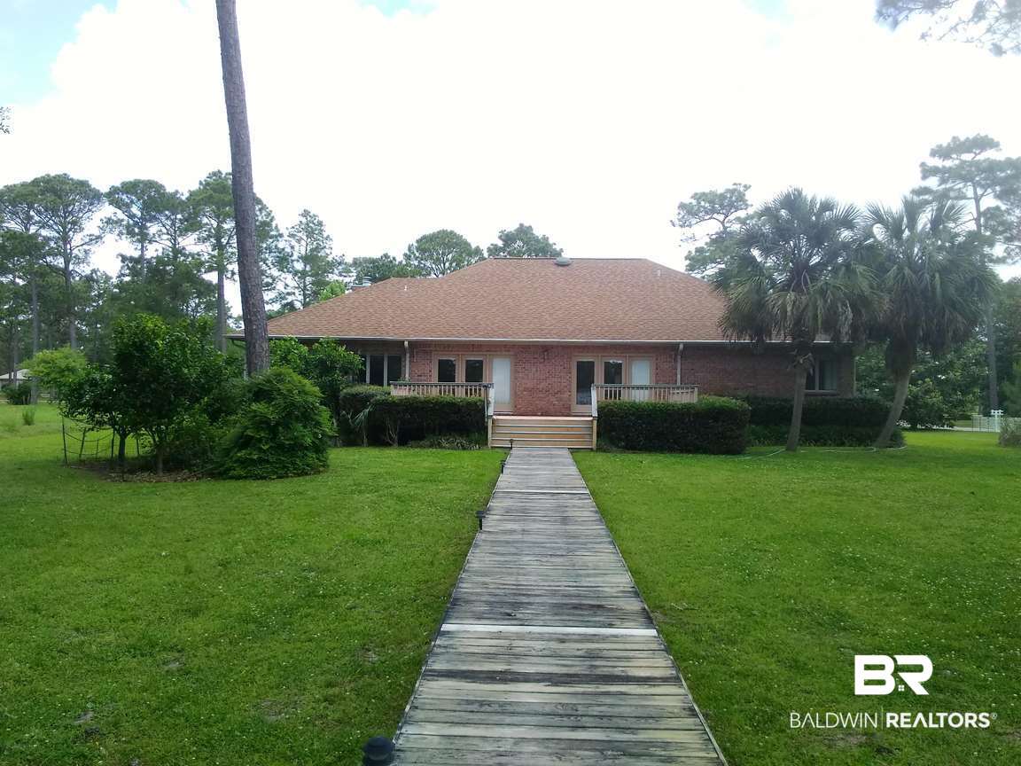 8132 Bay View Drive Foley, AL 36535 - Photo 34 of 50 Back view to deck