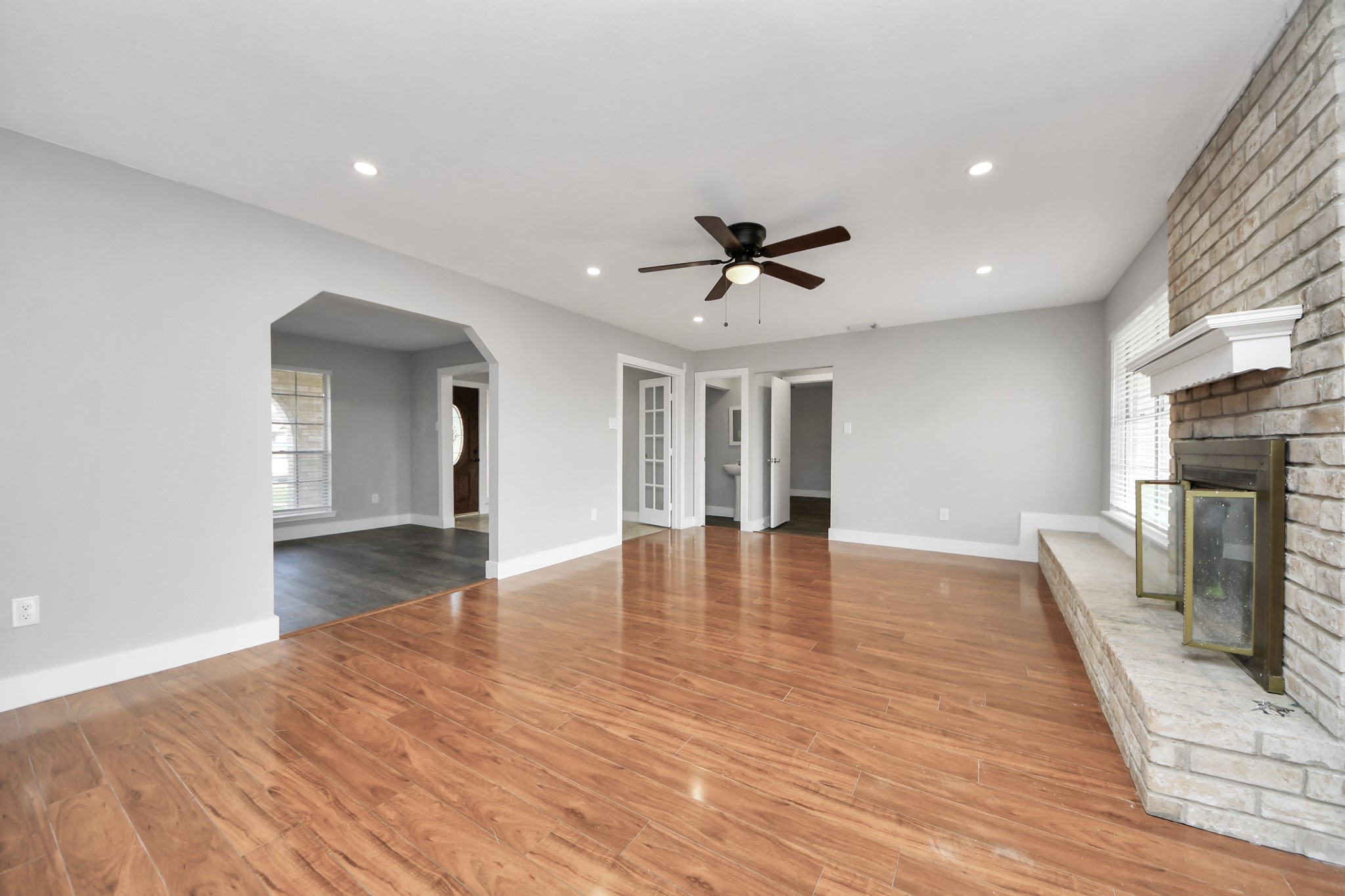 15423 Ridingwood Drive Houston, TX 77489 - Photo 11 of 43 a view of empty room with wooden floor and fireplace