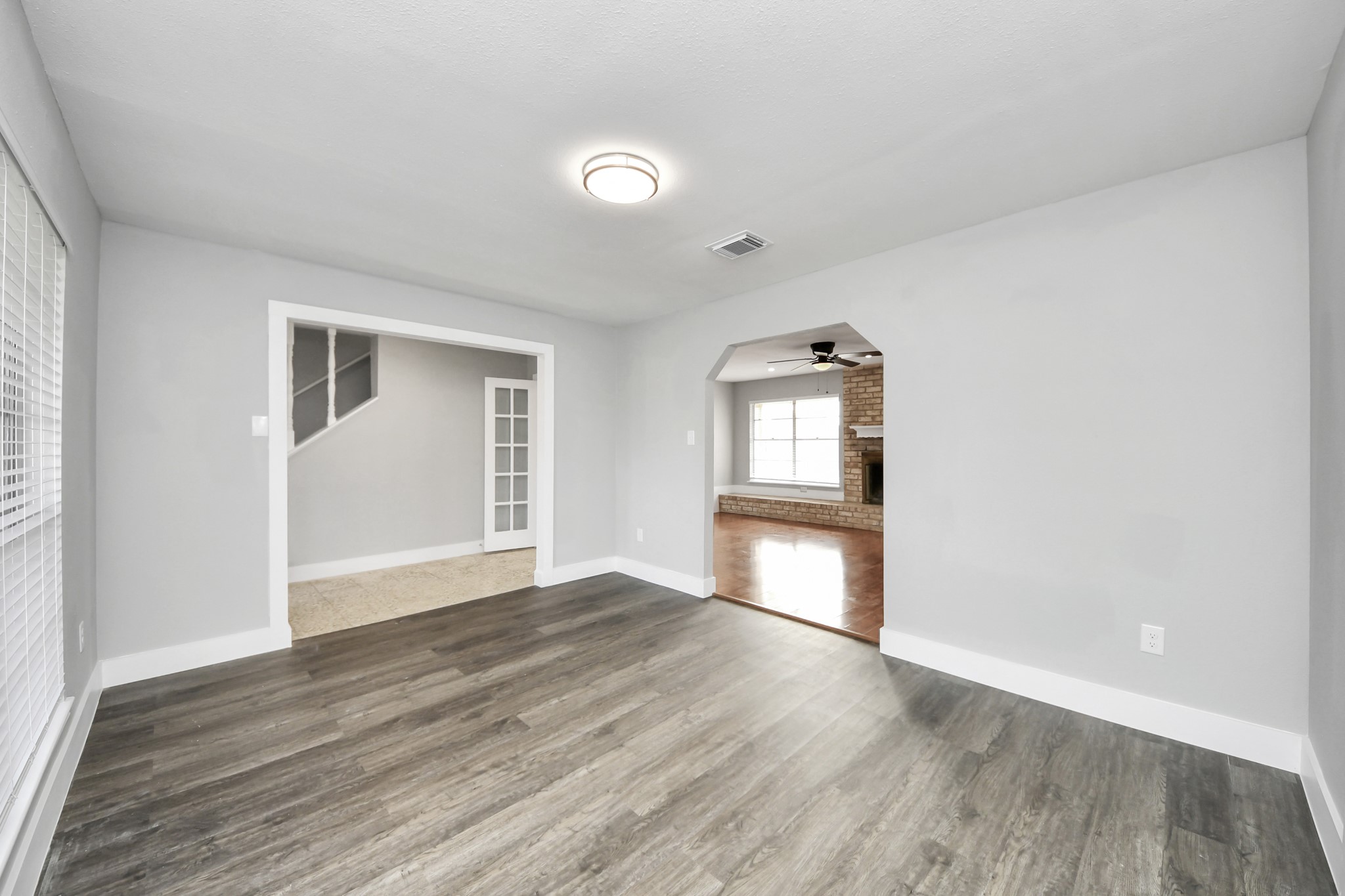 15423 Ridingwood Drive Houston, TX 77489 - Photo 12 of 43 an empty room with wooden floor and windows