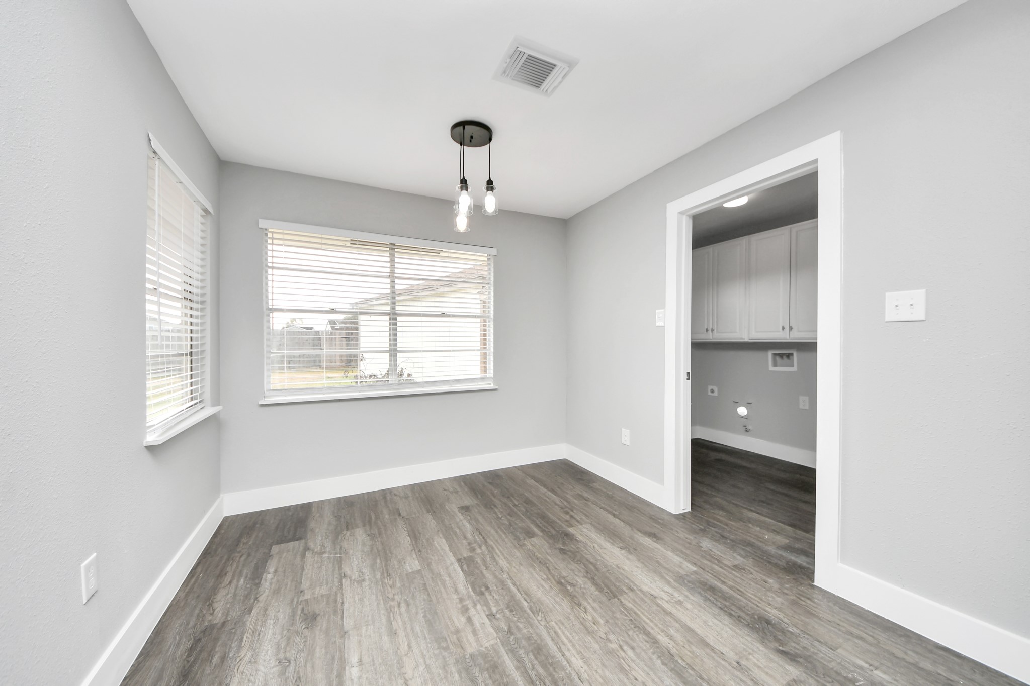 15423 Ridingwood Drive Houston, TX 77489 - Photo 16 of 43 a view of an empty room with wooden floor and a window