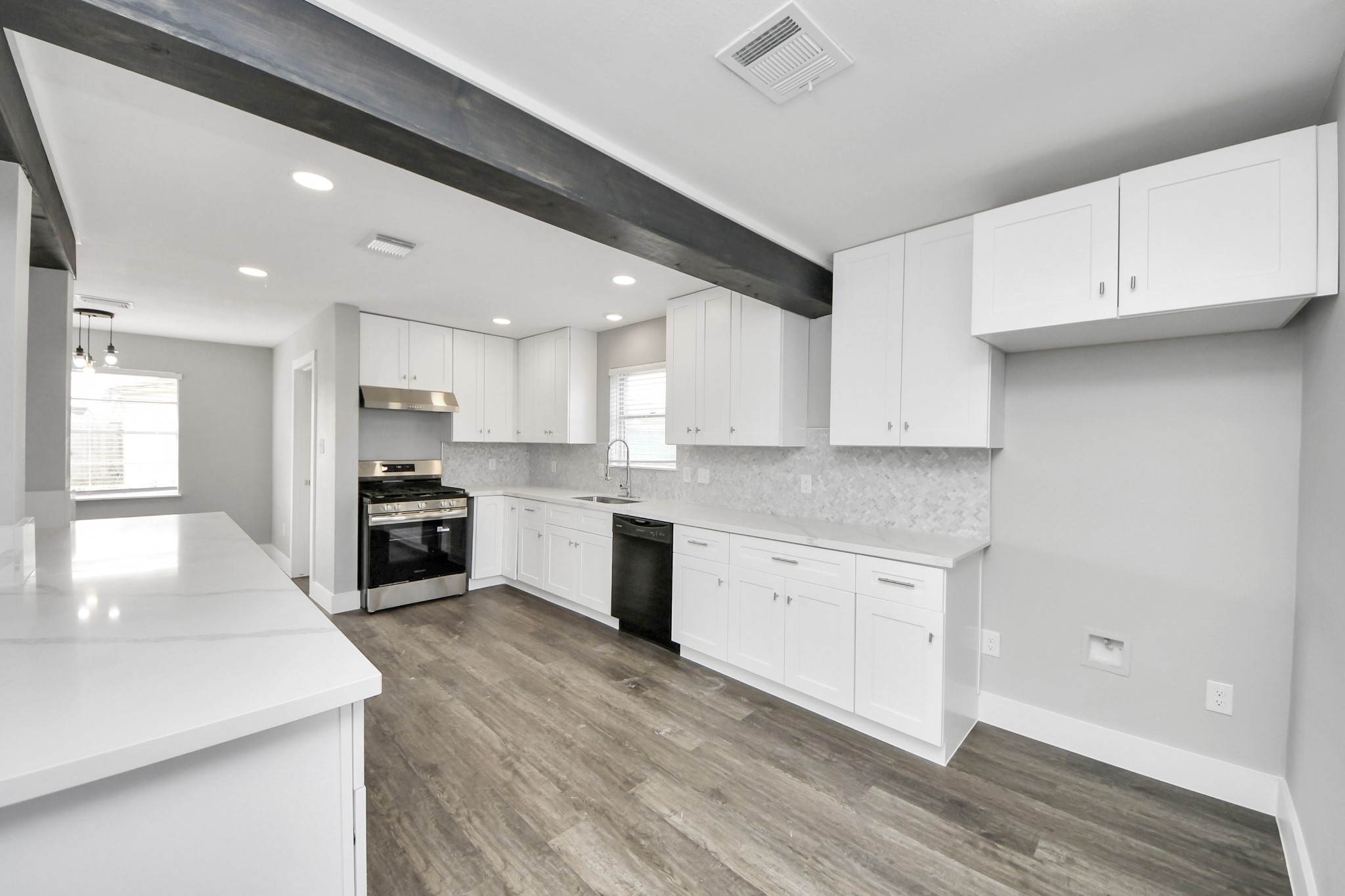 15423 Ridingwood Drive Houston, TX 77489 - Photo 19 of 43 a kitchen with granite countertop white cabinets and stainless steel appliances