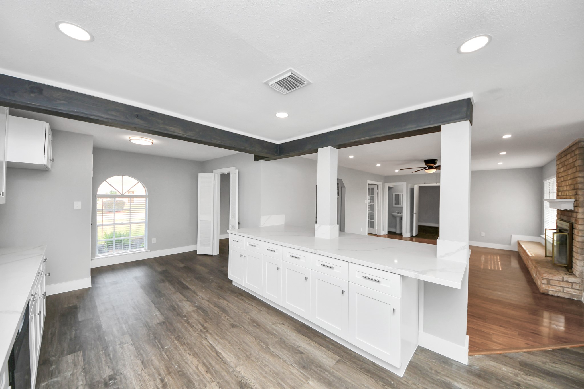15423 Ridingwood Drive Houston, TX 77489 - Photo 20 of 43 a large white kitchen with lots of counter space and chandelier