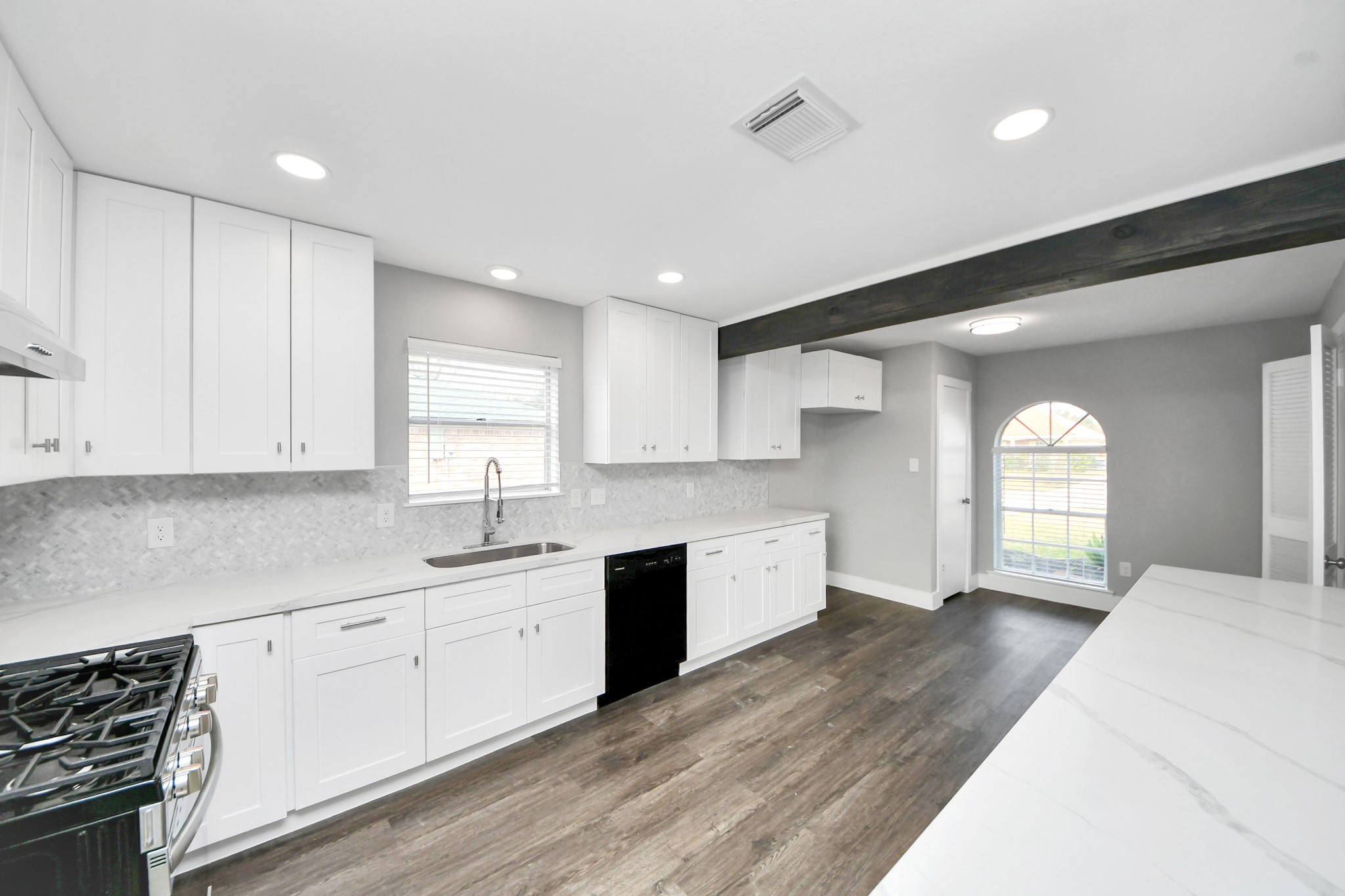 15423 Ridingwood Drive Houston, TX 77489 - Photo 21 of 43 a kitchen with granite countertop a sink a window and cabinets