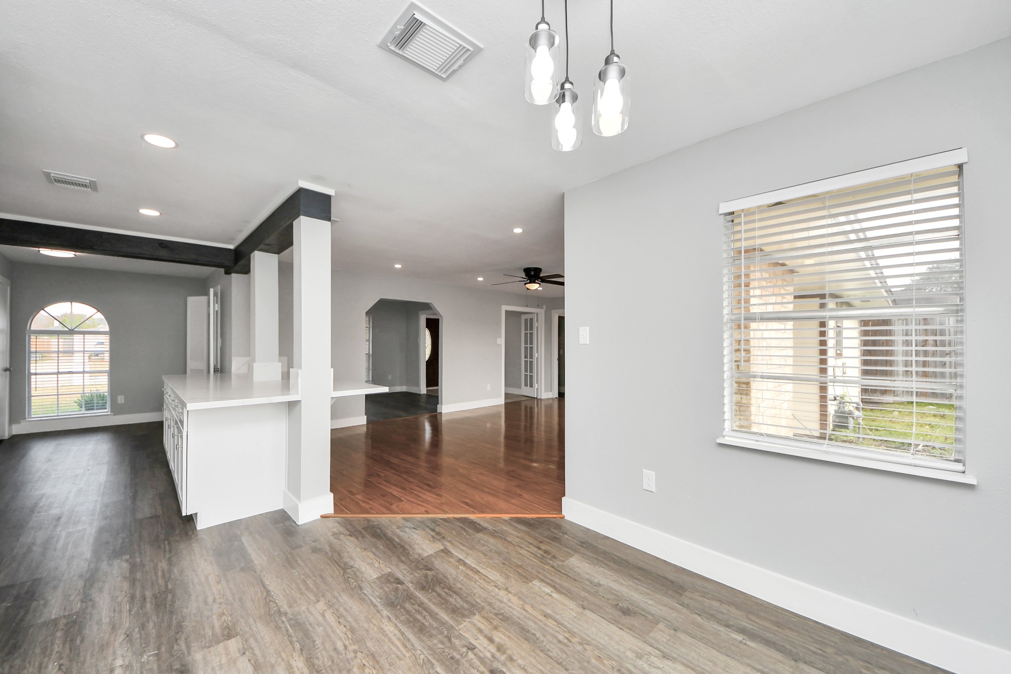 15423 Ridingwood Drive Houston, TX 77489 - Photo 22 of 43 a view of a living room and kitchen with furniture wooden floor kitchen view