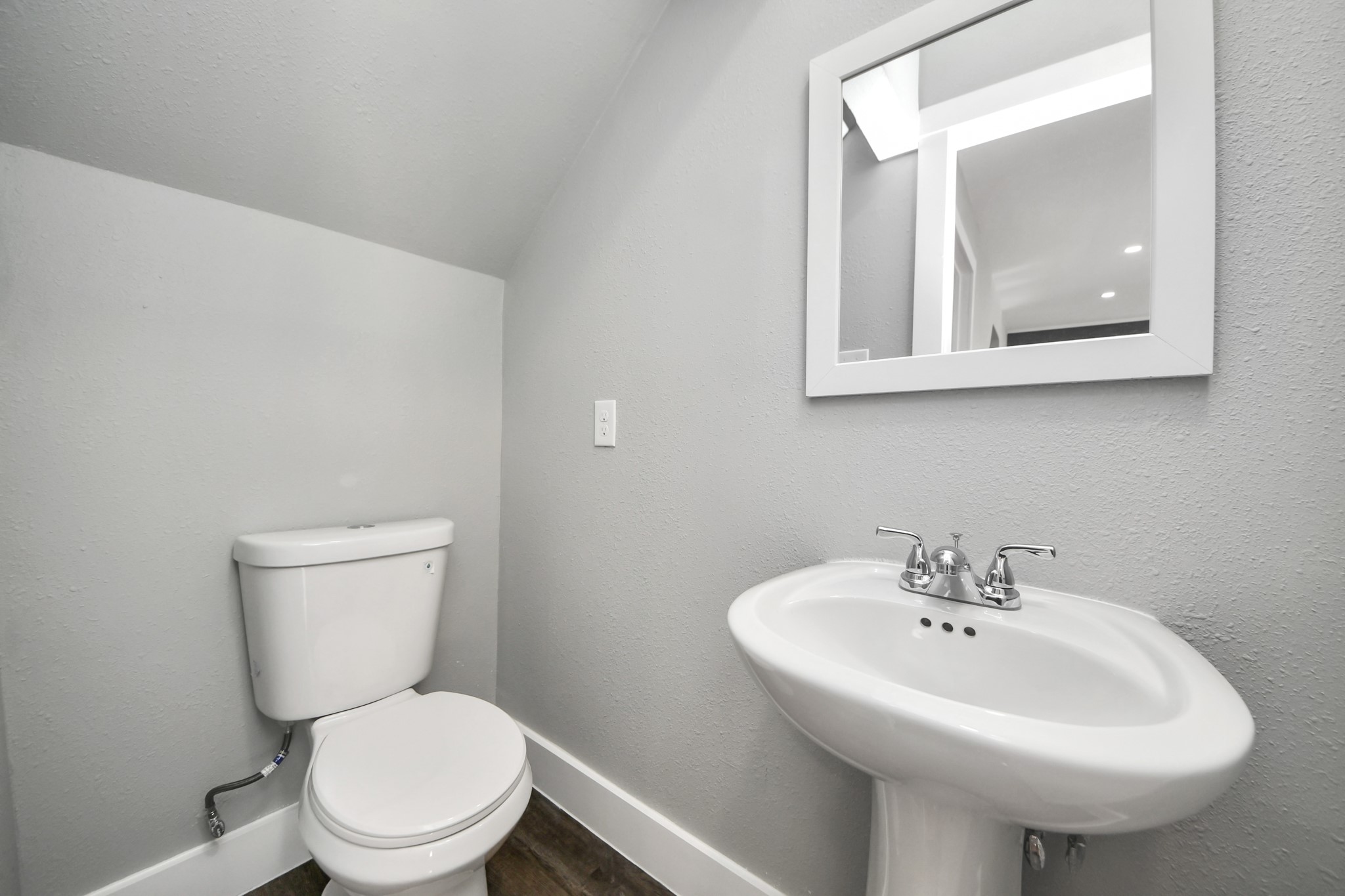 15423 Ridingwood Drive Houston, TX 77489 - Photo 24 of 43 a white toilet sitting next to a white sink
