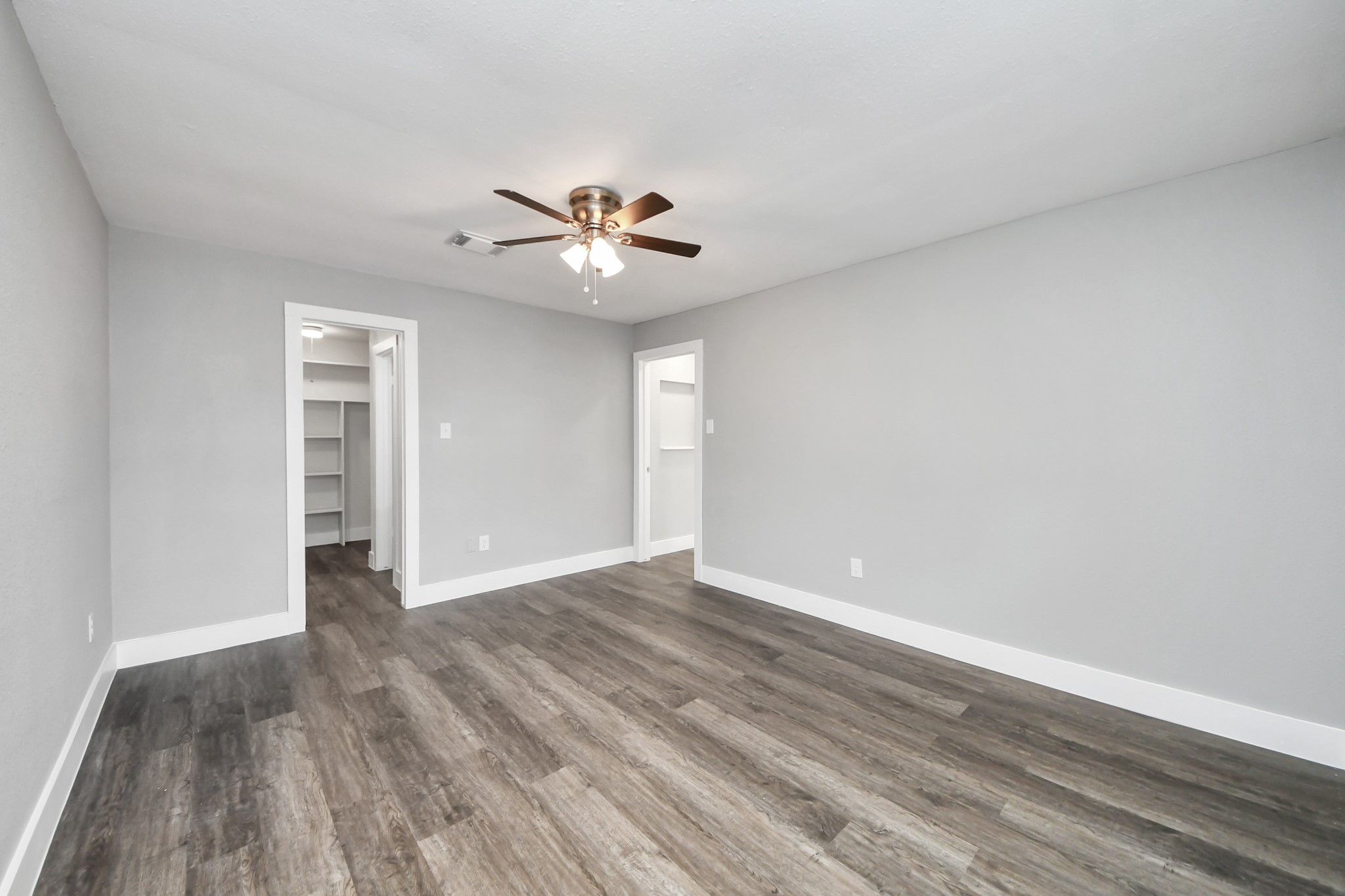 15423 Ridingwood Drive Houston, TX 77489 - Photo 26 of 43 a view of an empty room with a window and wooden floor