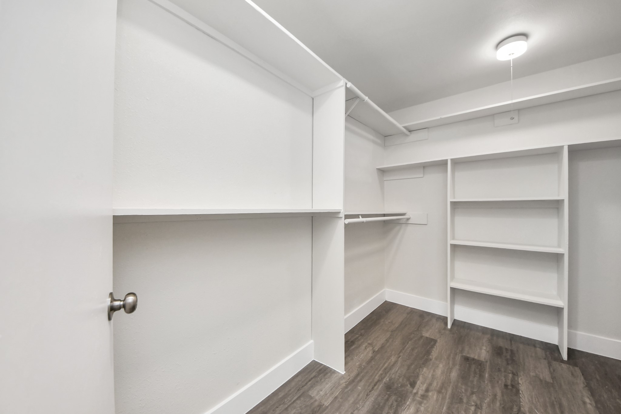 15423 Ridingwood Drive Houston, TX 77489 - Photo 27 of 43 a view of walk in closet with empty racks