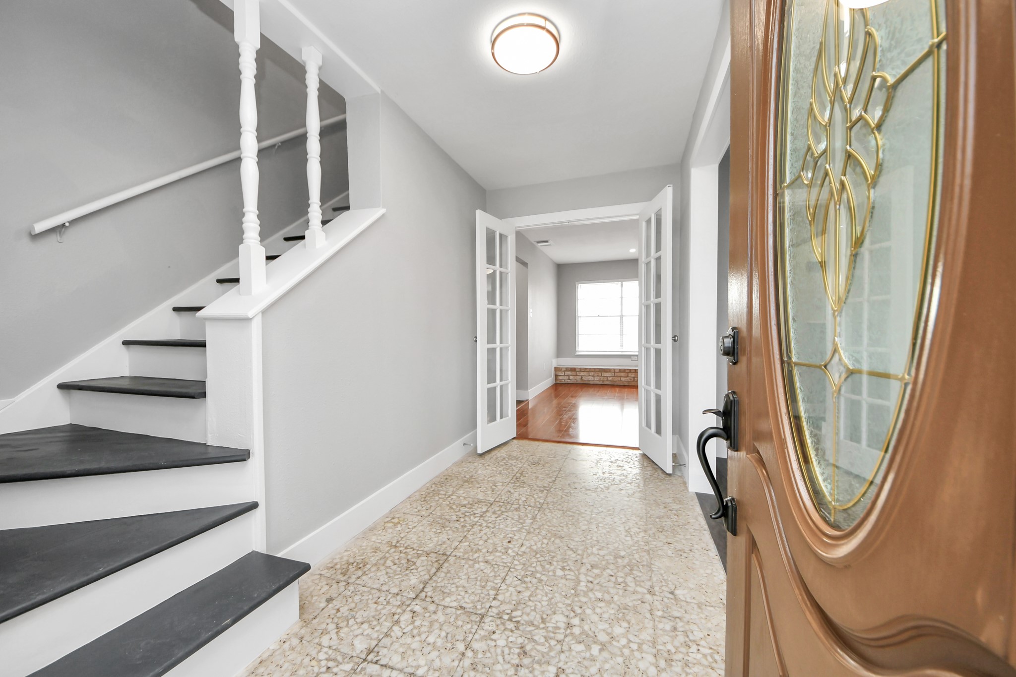 15423 Ridingwood Drive Houston, TX 77489 - Photo 5 of 43 a view of a hallway with wooden floor and staircase