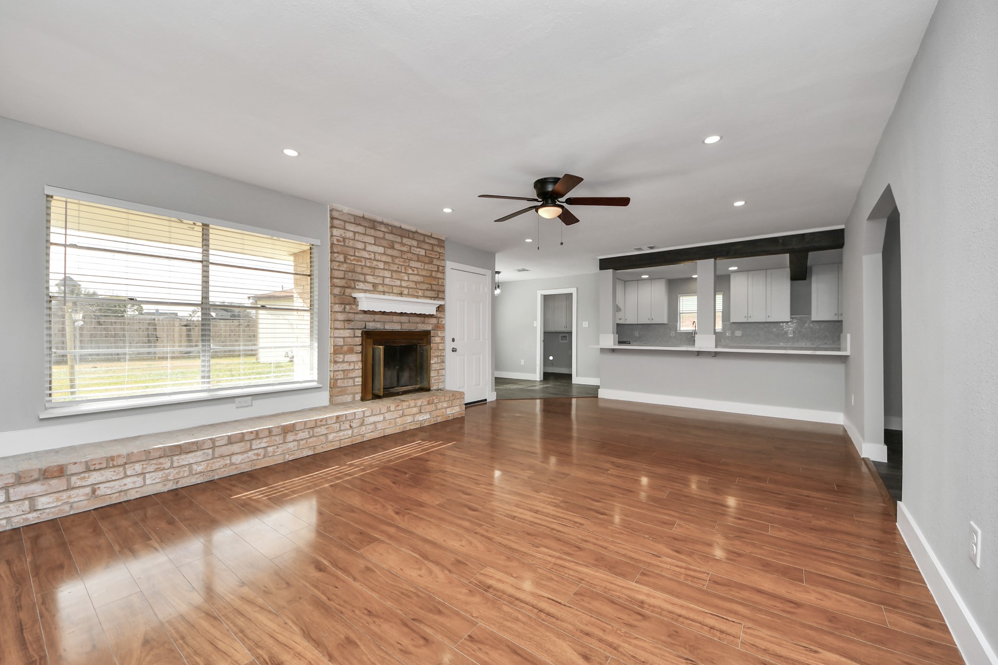 15423 Ridingwood Drive Houston, TX 77489 - Photo 8 of 43 a view of an empty room with wooden floor and a window
