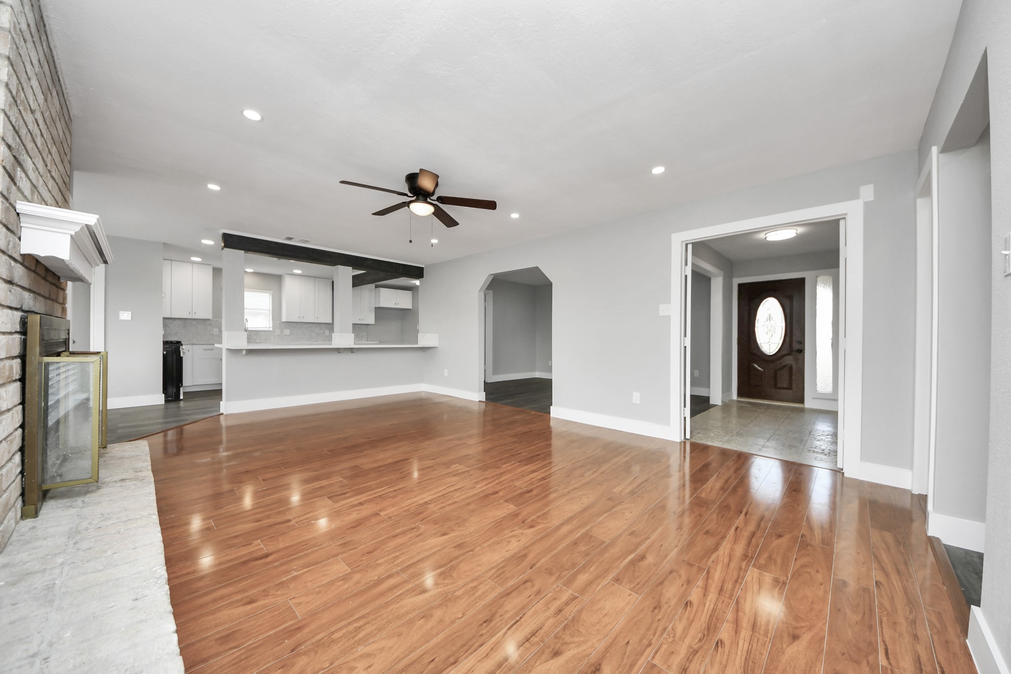 15423 Ridingwood Drive Houston, TX 77489 - Photo 9 of 43 a view of livingroom and kitchen with wooden floor