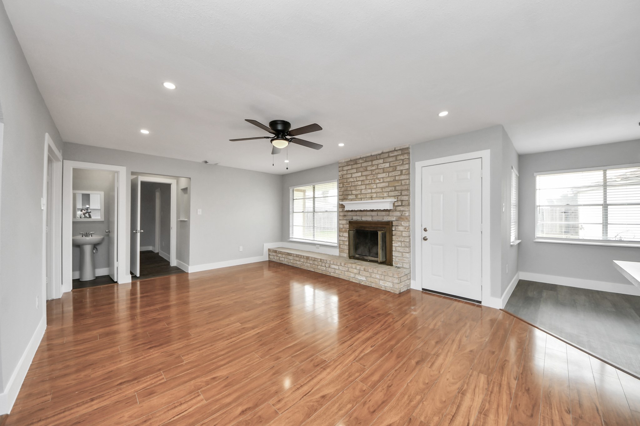 15423 Ridingwood Drive Houston, TX 77489 - Photo 10 of 43 a view of an empty room with window and wooden floor