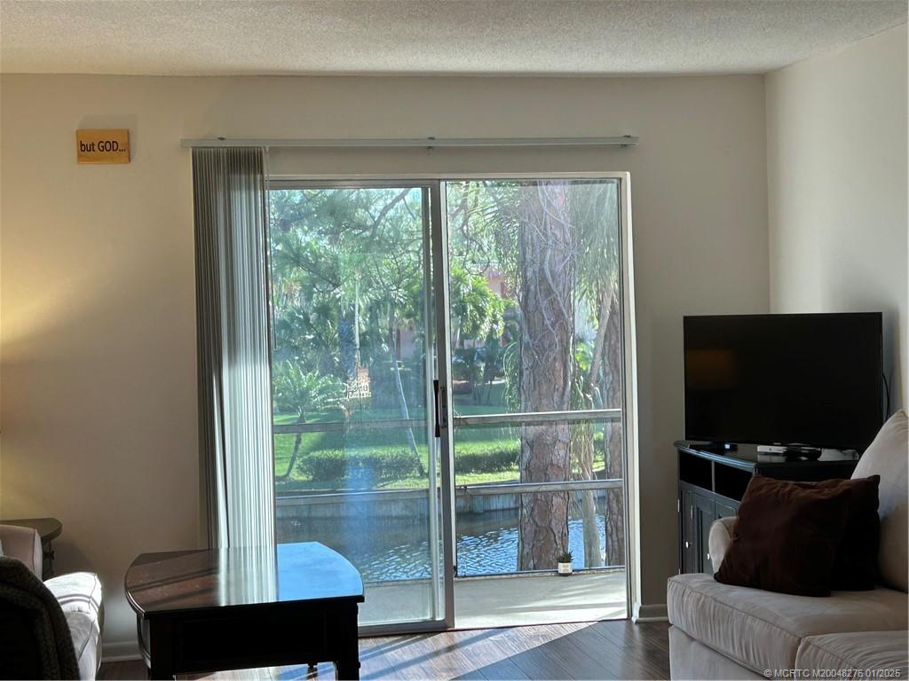 1997 Southwest Palm City Road, Unit 48H Stuart, FL 34994 - Photo 13 of 49 Sliders to the balcony