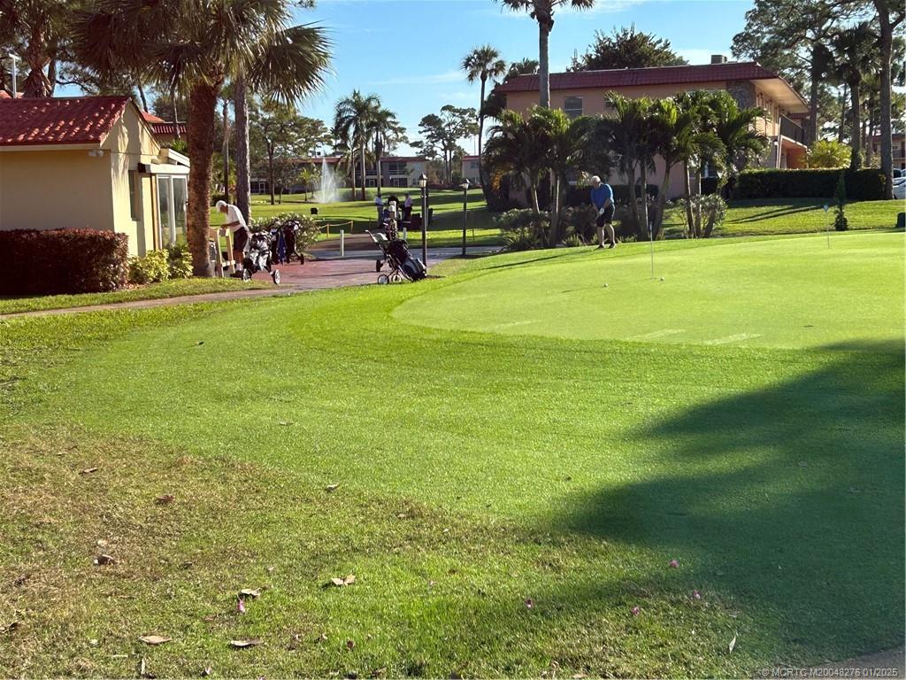 1997 Southwest Palm City Road, Unit 48H Stuart, FL 34994 - Photo 30 of 49 Sign-in and putting green